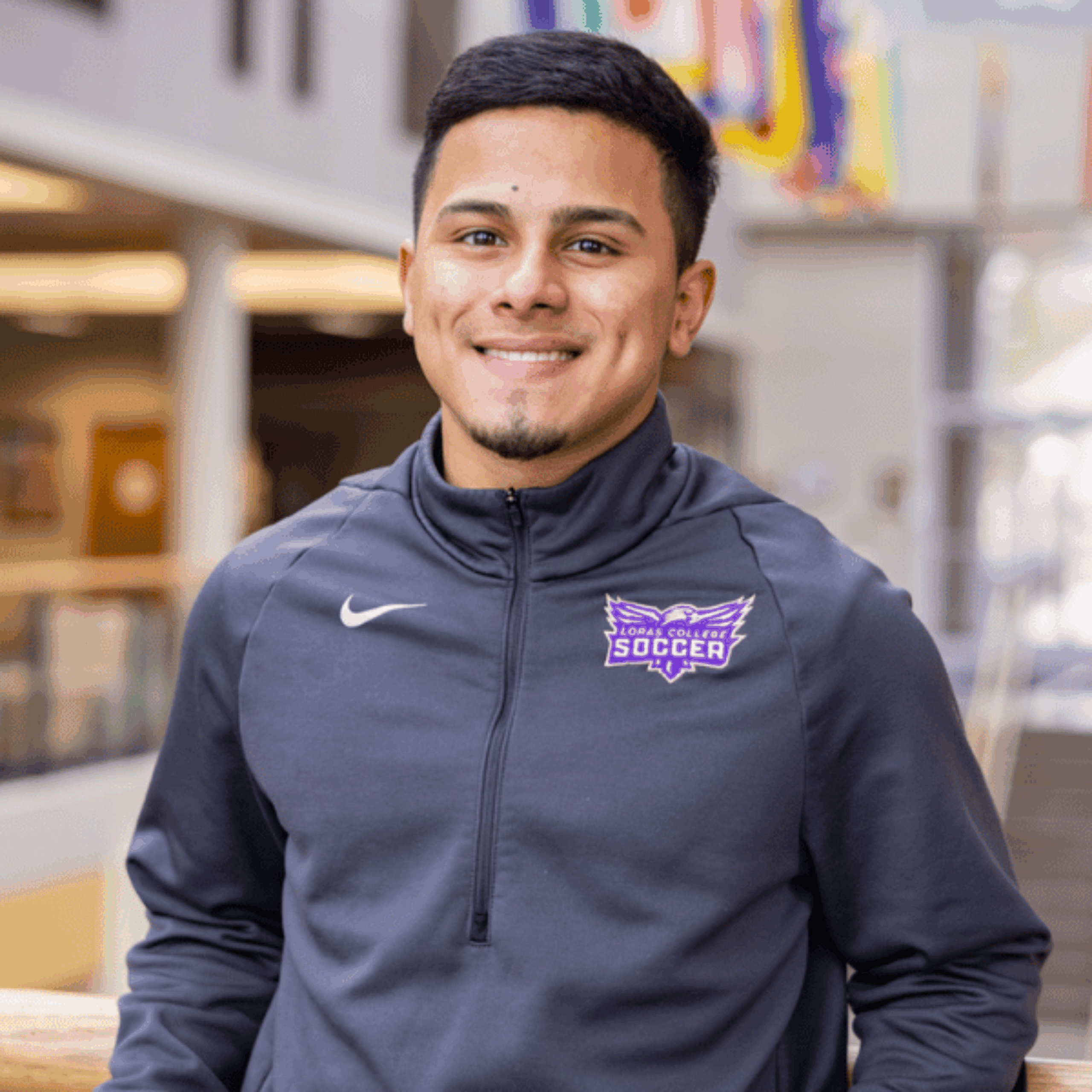 student standing in the Alumni Campus Center