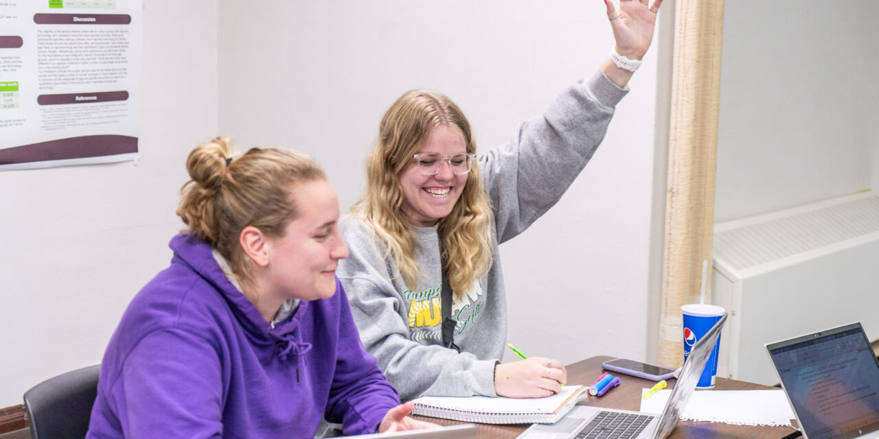 Loras College Mathematics Major students in class asking questions