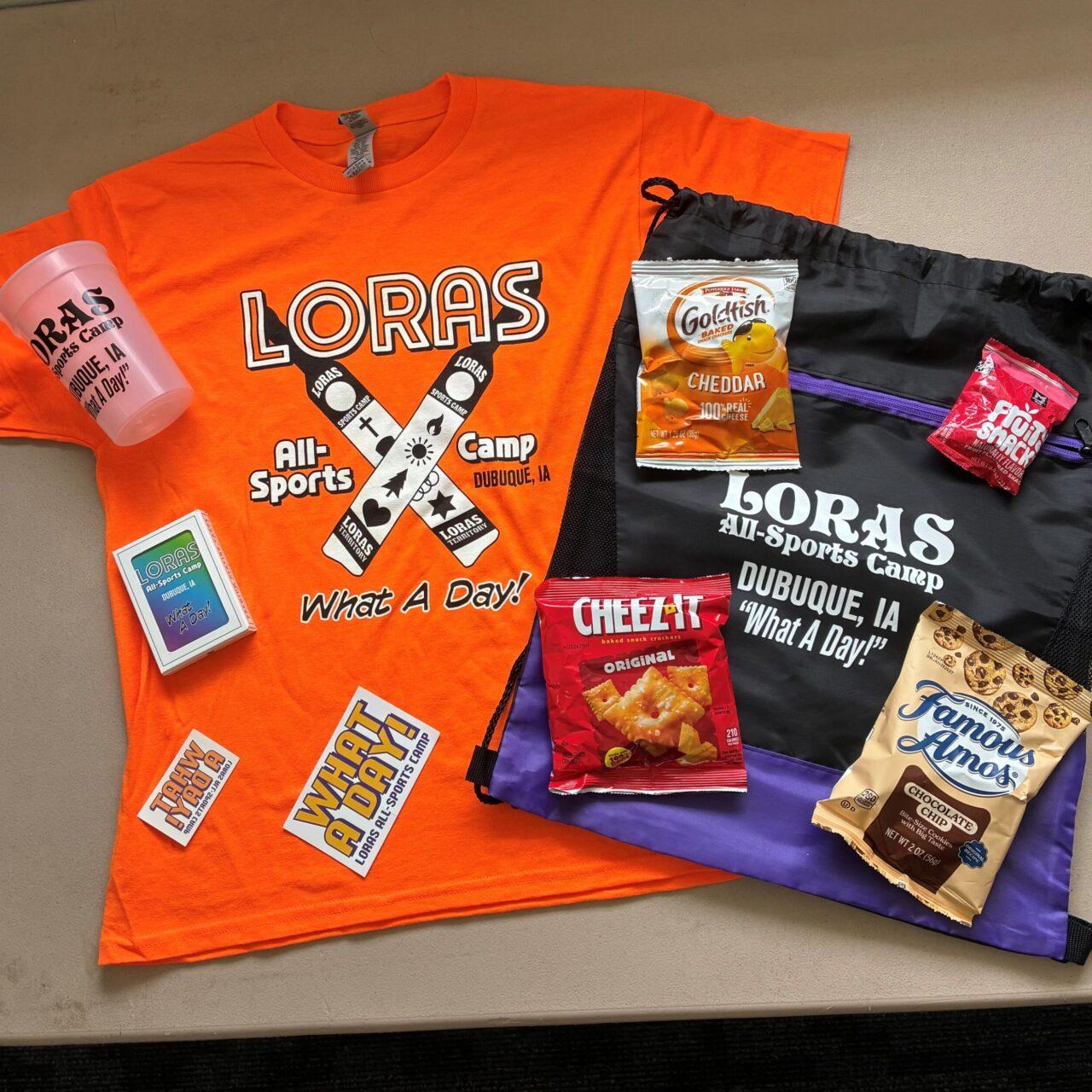 various items included in the all sports camp care package including an orange t-shirt, drinking cup, and various snacks