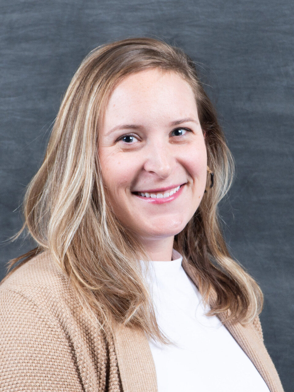 headshot Sarah Cassella, Neuroscience professor smiling