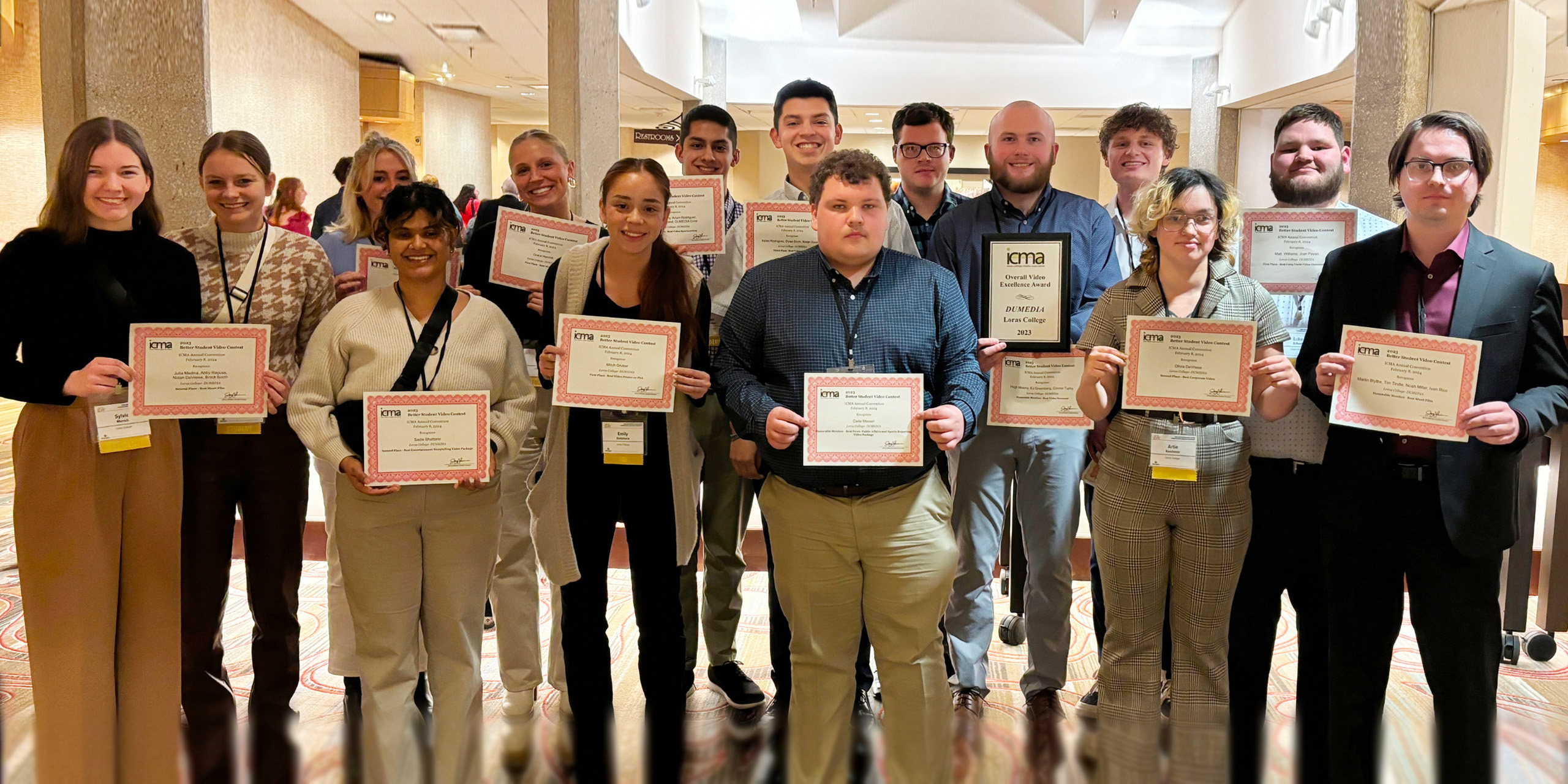 Students part of DuMedia standing with their awards at the ICMA 2024.