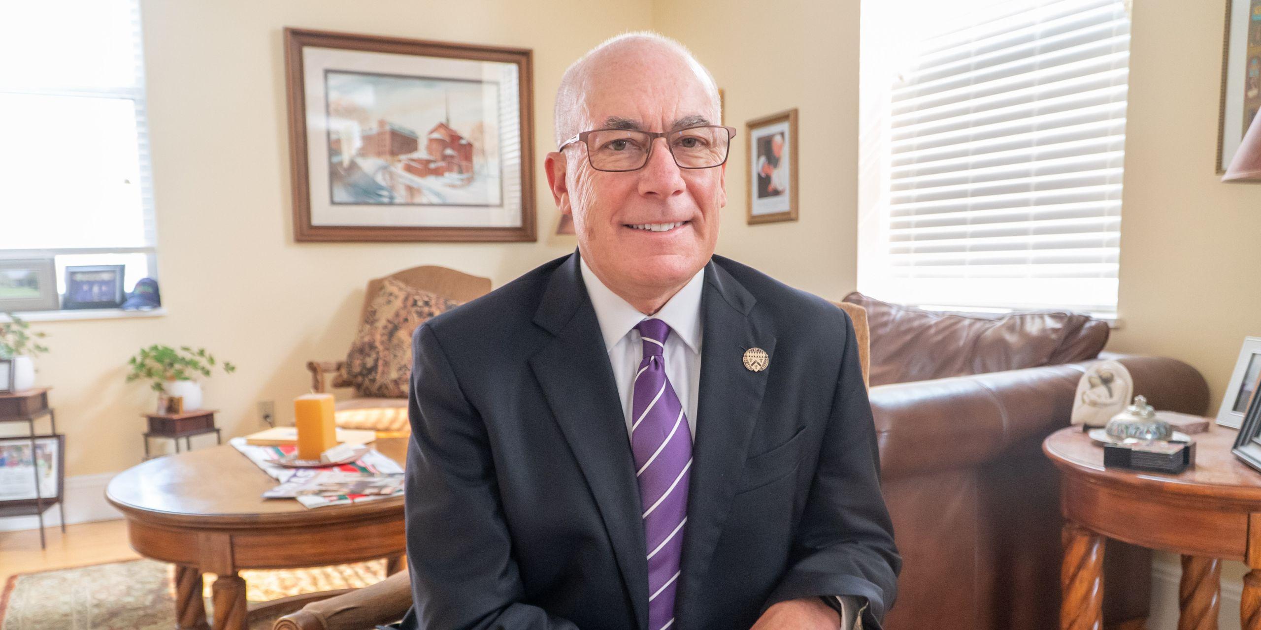 Jim Collins ('84) poses in his office at Loras College