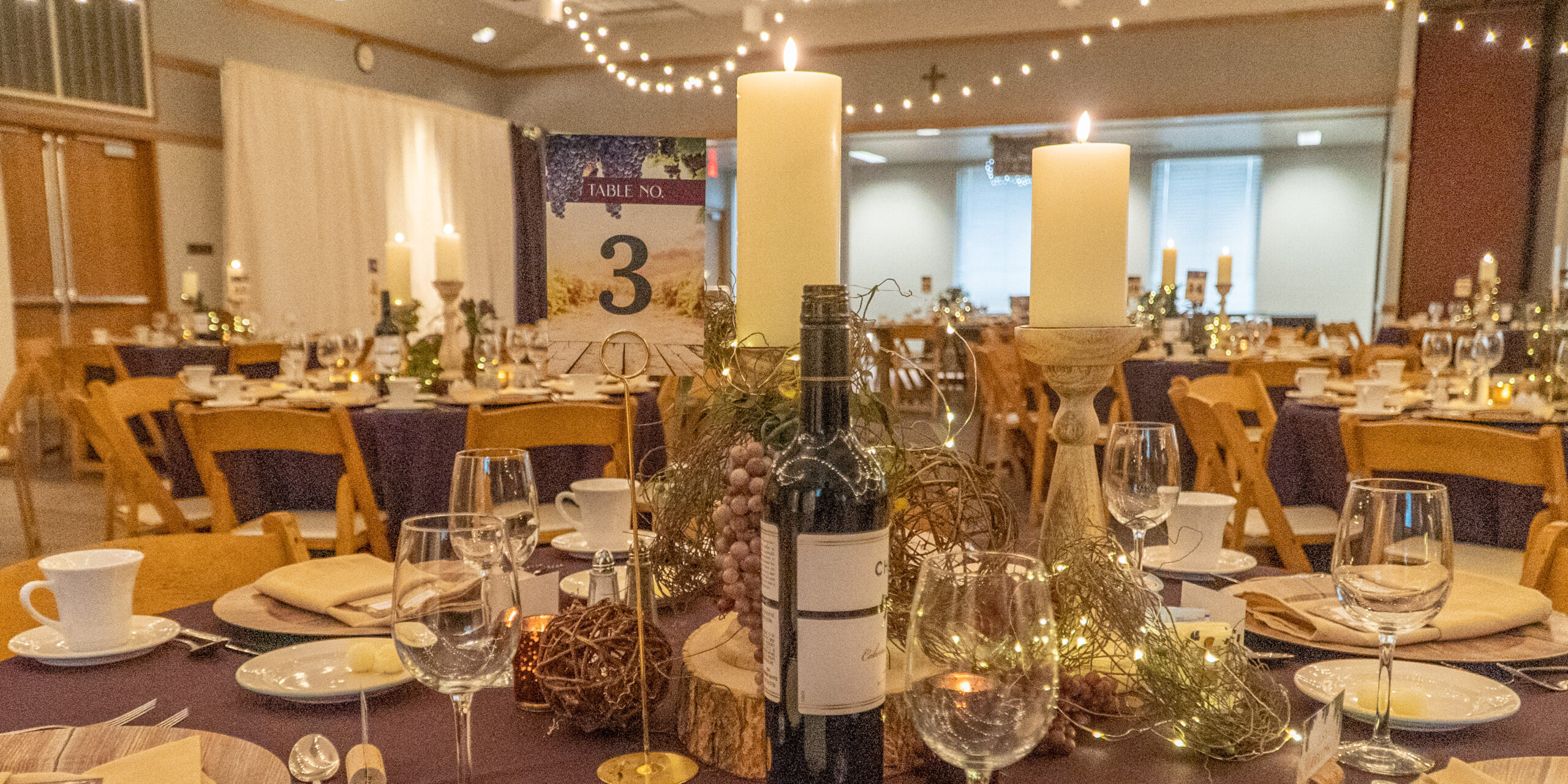 Wide view of decorations and fancy table settings in preparation for the annual Legacy Ball