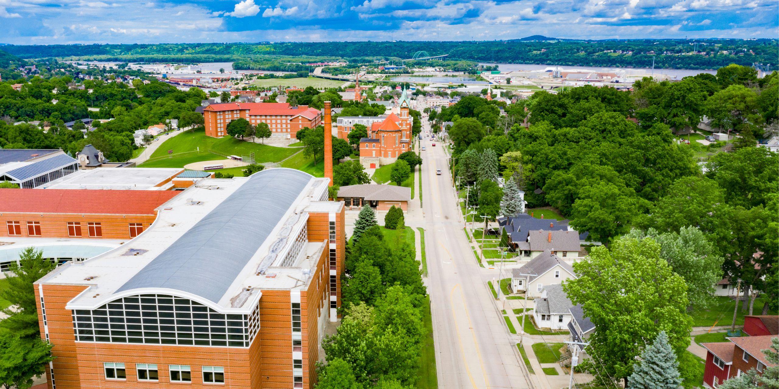 Aerial view of city with brick buildings and long road