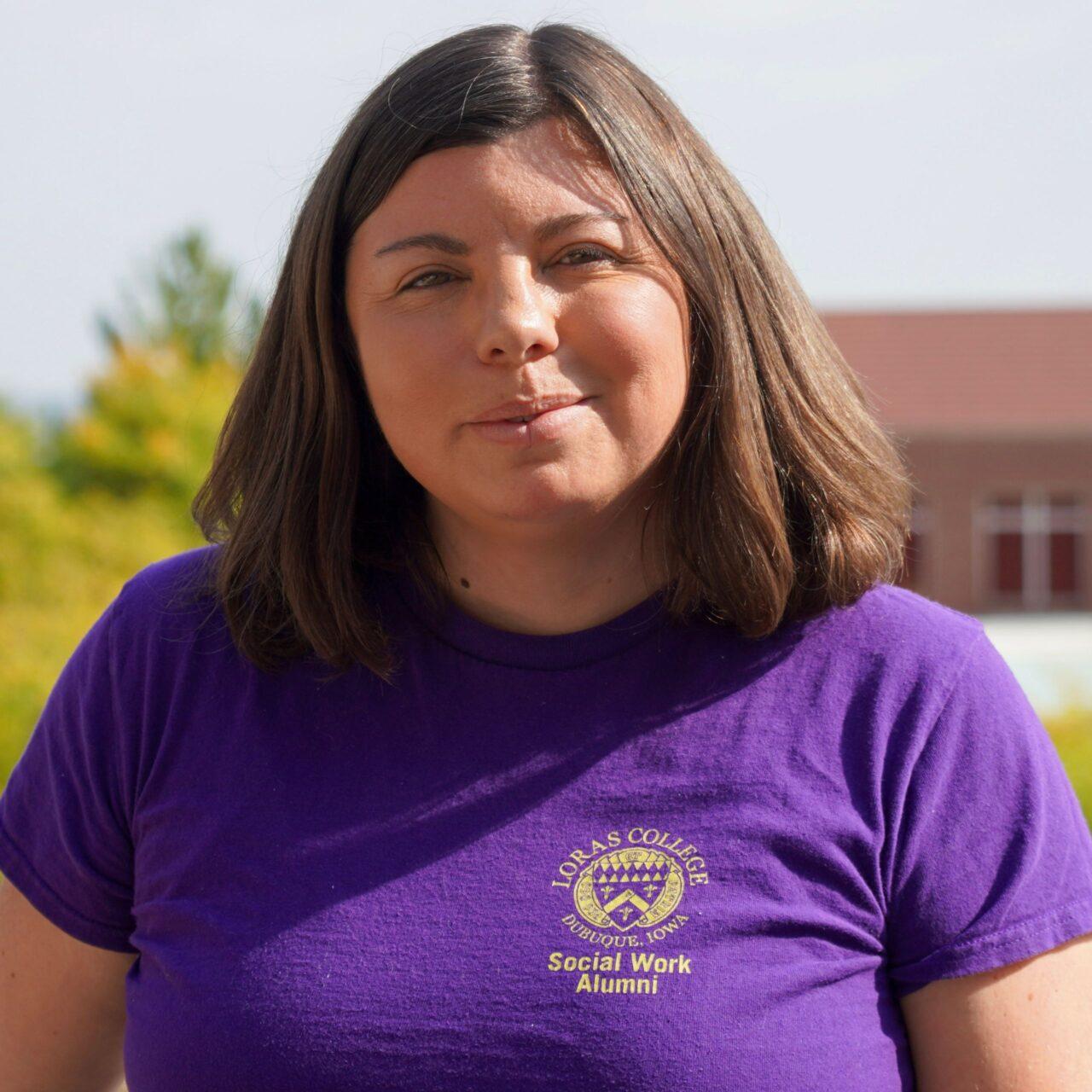 Woman smiling in purple shirt