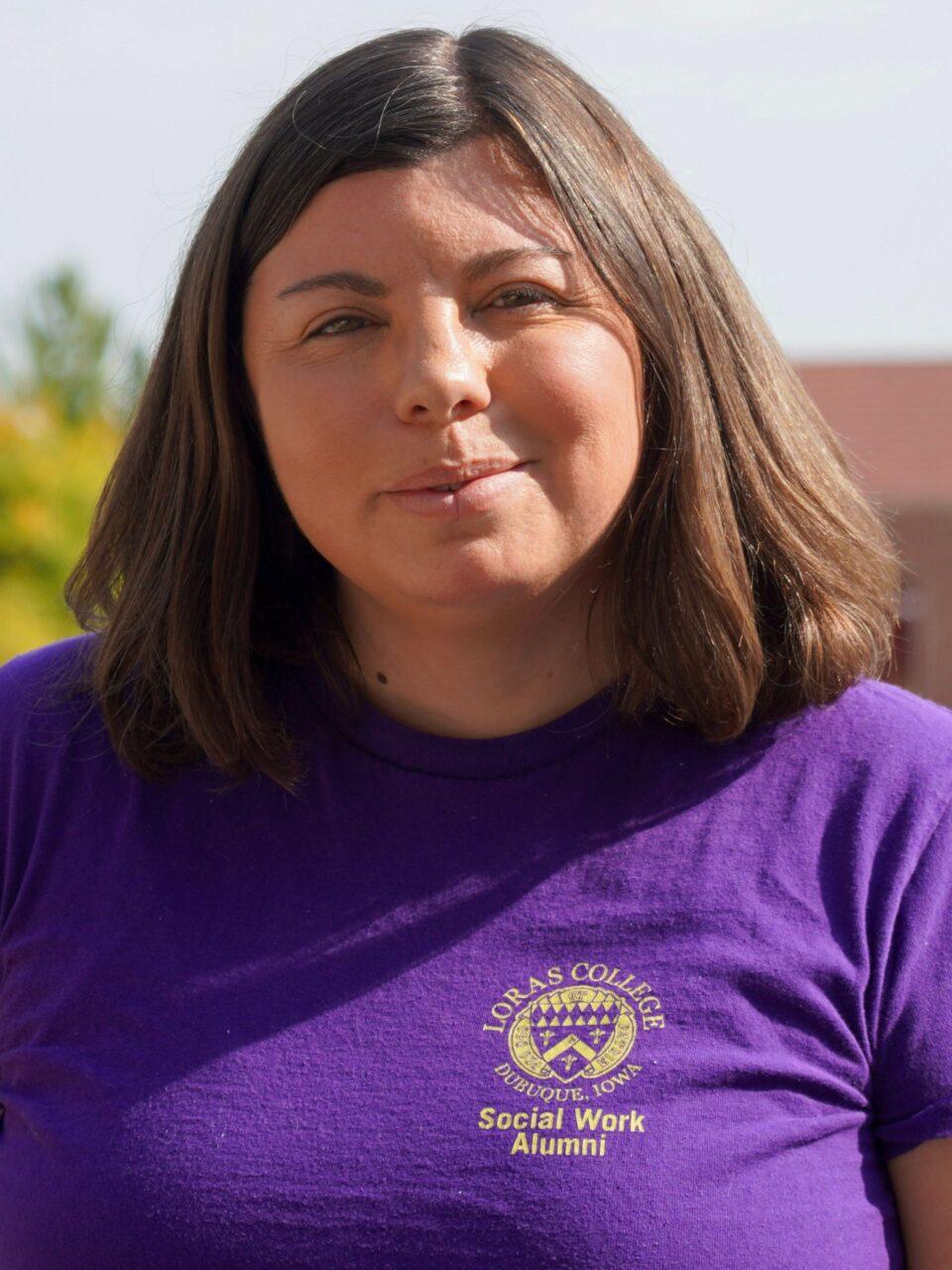 Woman smiling in purple shirt