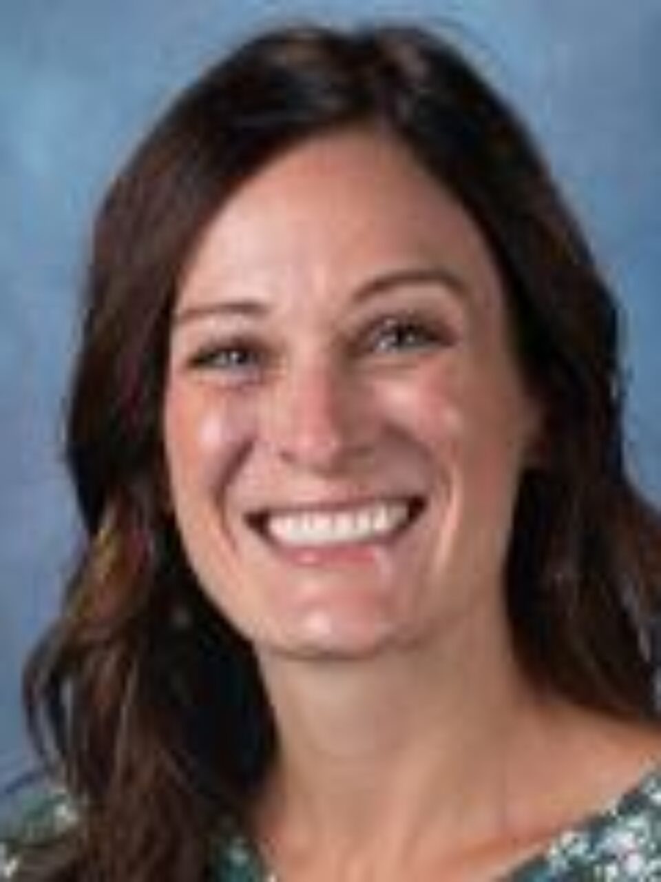 Image of faculty member smiling at the camera