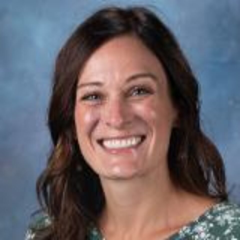 Image of faculty member smiling at the camera