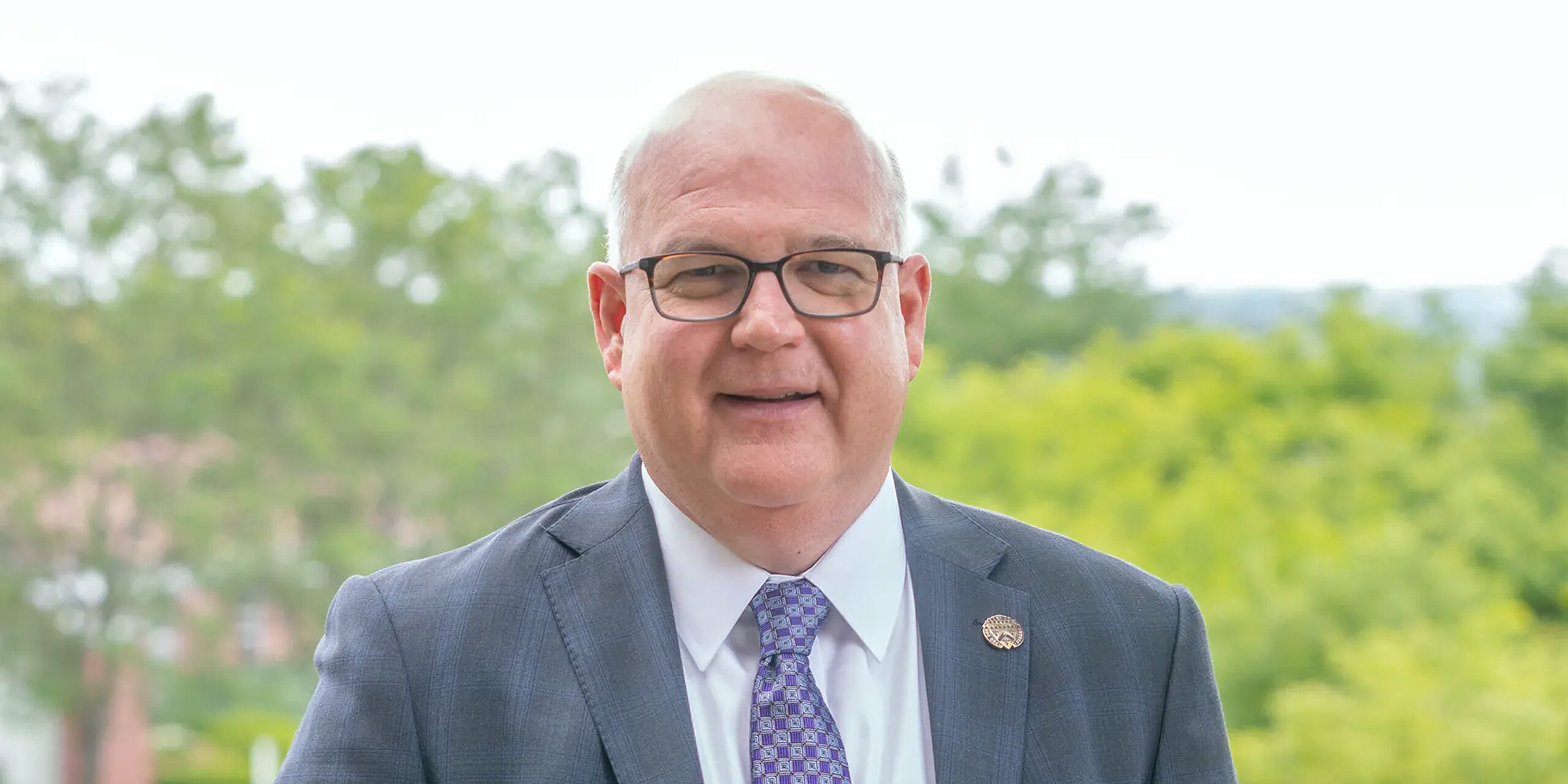 Alumnus and President-Elect Mike Doyle '91 with campus in the background.