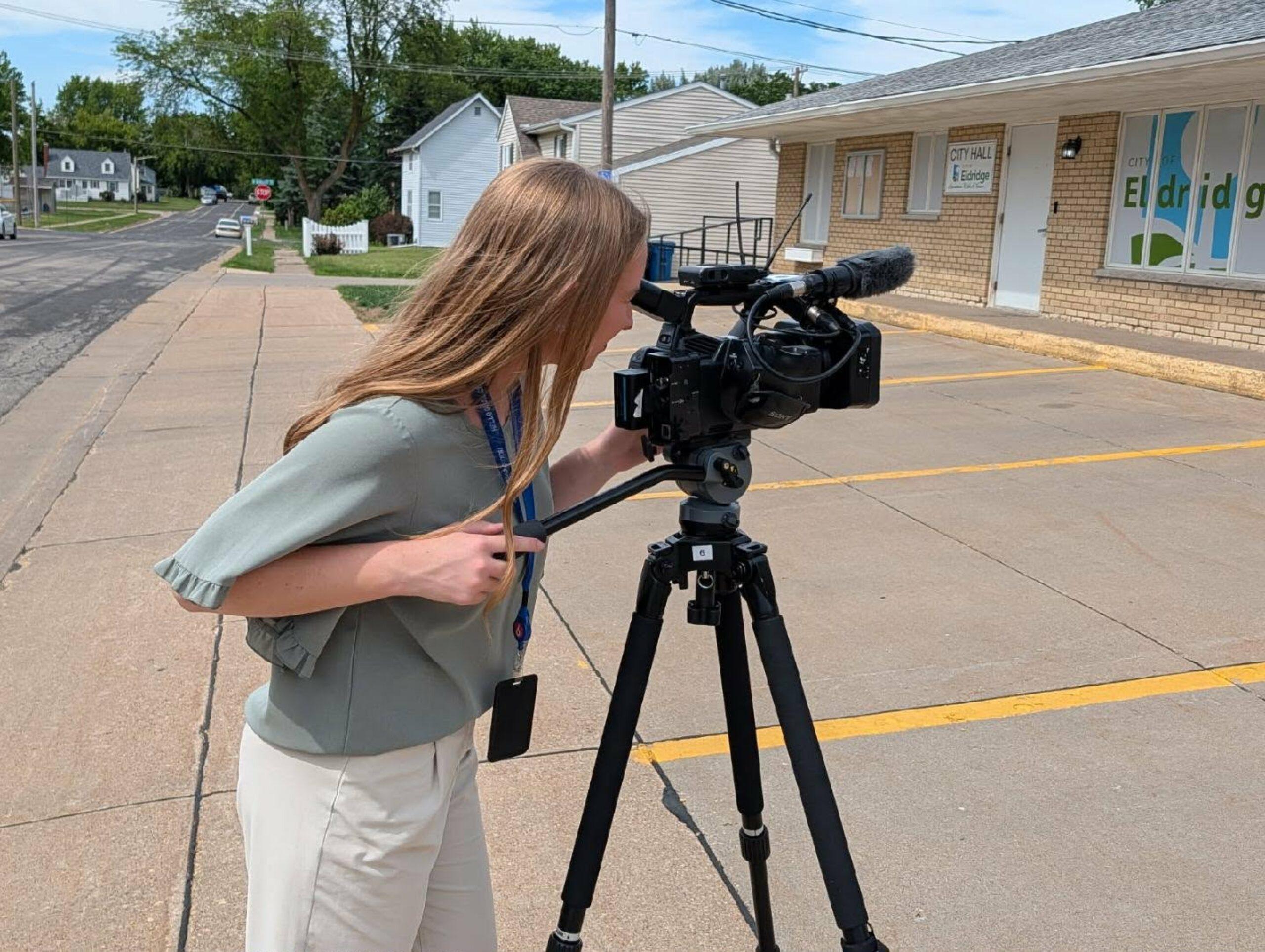 student with camera
