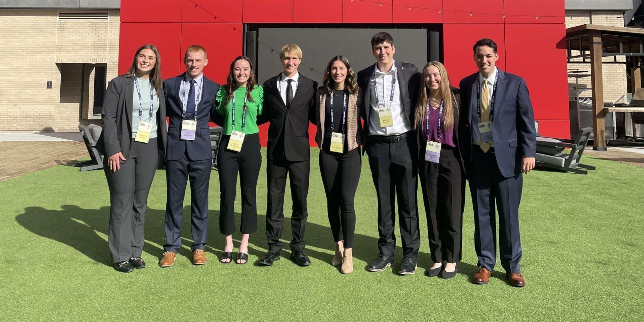 Loras students pose in St. Louis, MO outside the 2024 SMA Case Study Competition