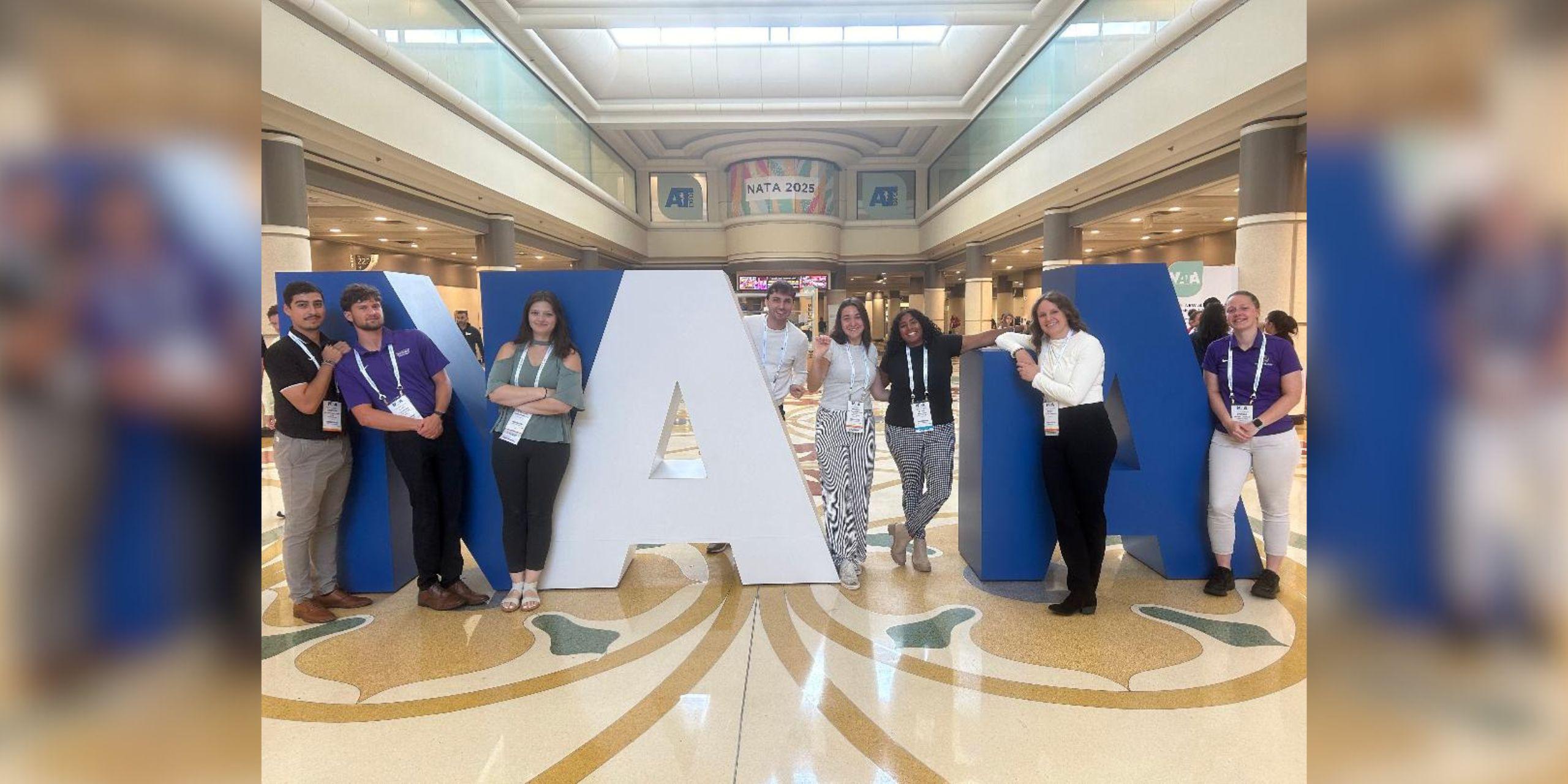 Duhawks pose at the NATA Convention in Orlando, Florida