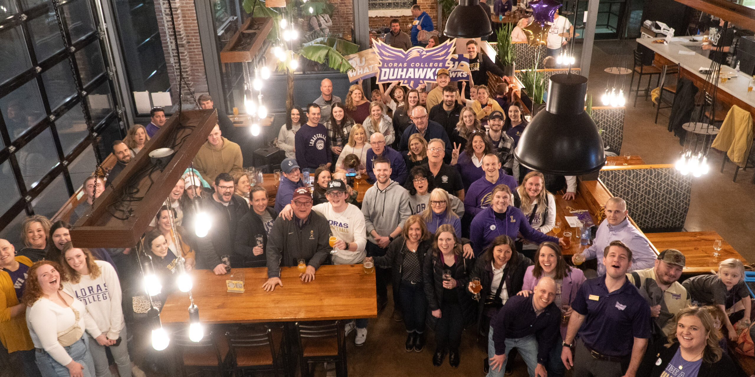 A Full house at Dimensional Brewing of Loras College Duhawk Alumni & friends gathering together to Unite, Celebrate, and Support Loras Student Success.