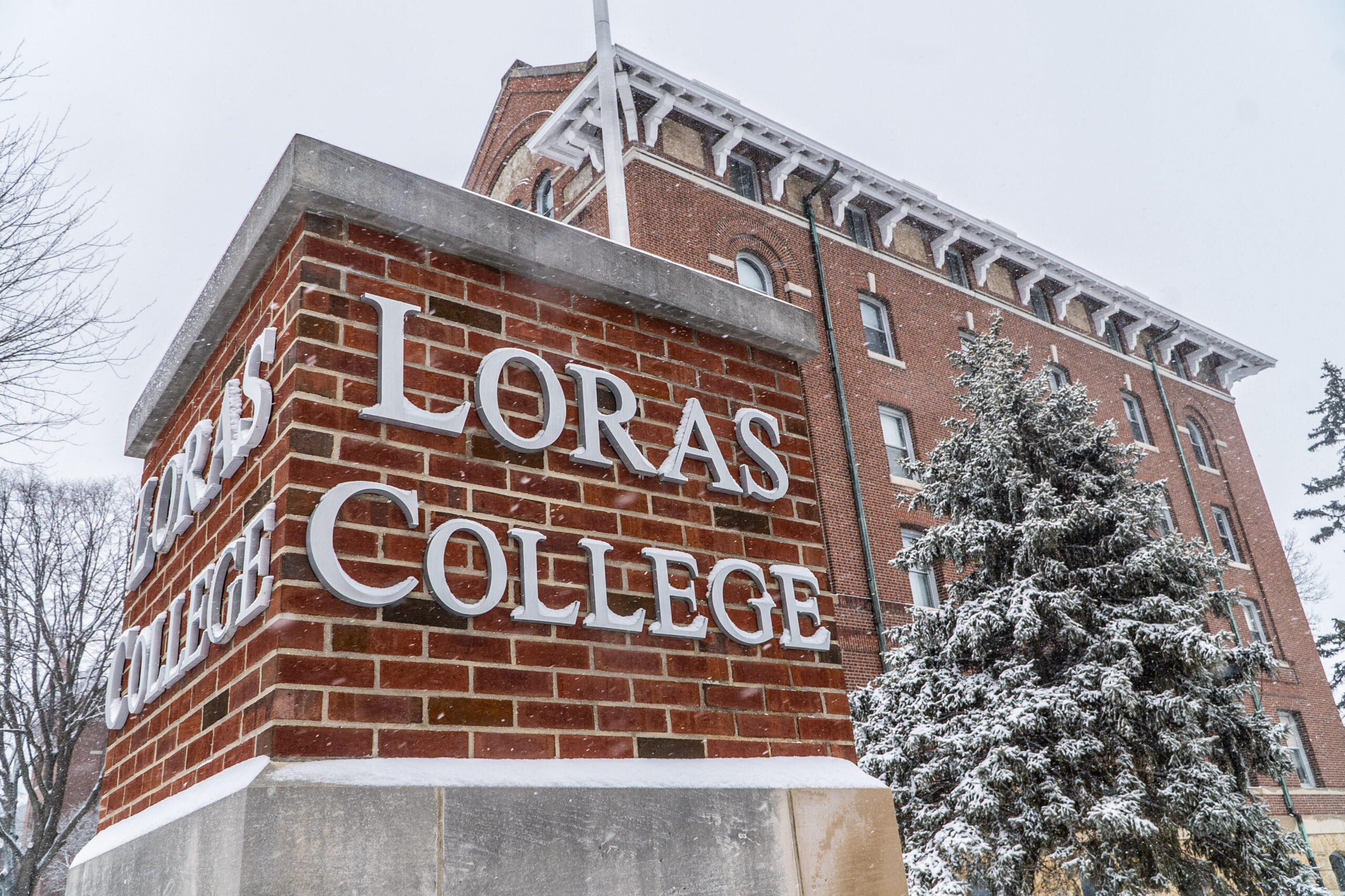 Loras College brick piker in front of Keane Hall